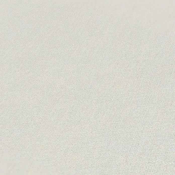 A.S. Création Maison Charme Vliestapete - Grau, Uni, 10,05 x 0,53 m - Ein detailliertes Nahaufnahmebild einer eleganten, cremefarbenen Tapete mit feiner Textur für stilvolle Innenräume.
