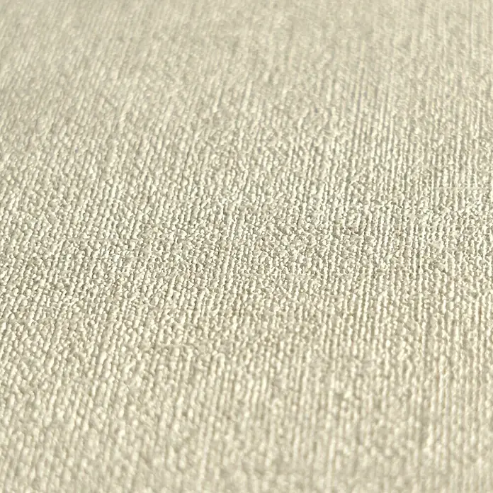 A.S. Création Metropolitan Stories Hot Spots Vliestapete - Hellbeige, Uni, 10,05 x 0,53 m - Nahaufnahme eines beigefarbenen Stoffes mit einer deutlichen Textur, ideal für Polsterarbeiten und Dekoration.