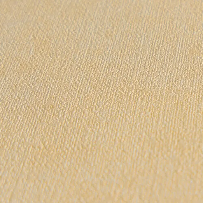 A.S. Création Metropolitan Stories Hot Spots Vliestapete - Beige-Gelb-Orange, Uni, 10,05 x 0,53 m - Nahaufnahme eines beigen strukturierten Materials, das eine subtile Eleganz und eine warme, einladende Atmosphäre ausstrahlt.