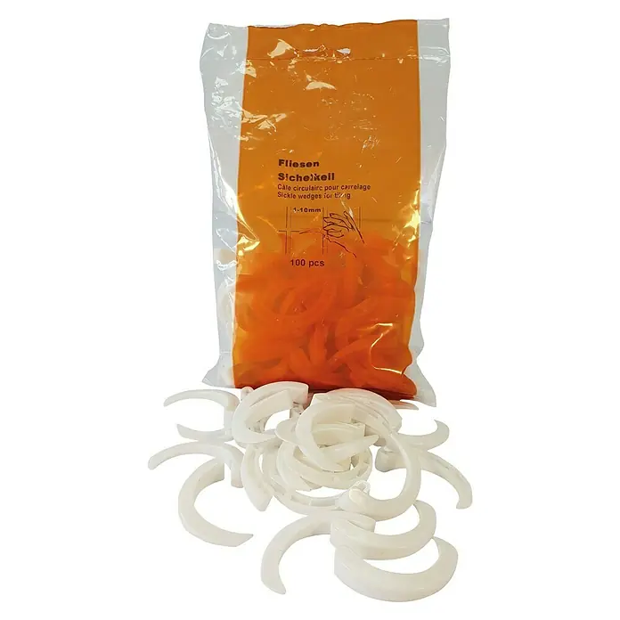 Heka Keile - Fugenbreite 1 - 10 mm, 100 Stk. - Ein Beutel Fliesenkeile, sowohl im Beutel als auch verstreut, für präzises und gleichmäßiges Verlegen von Fliesen.