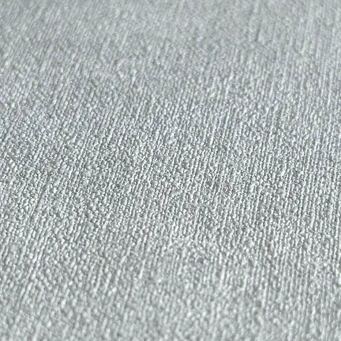 A.S. Création Pintwalls 2 Vliestapete - Grau-Blau, Uni, 10,05 x 0,53 m - Nahaufnahme einer weißen Vinyltapete mit feiner, reliefartiger Struktur, die eine elegante und zeitlose Wandgestaltung ermöglicht.