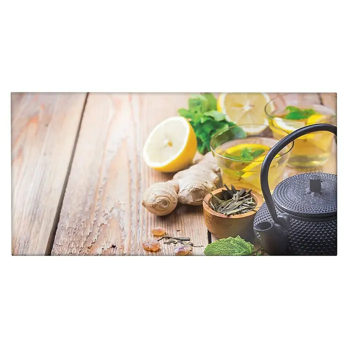CUCINE Küchenrückwand - Ginger Tea, 80 x 40 cm, Stärke: 6 mm, Einscheibensicherheitsglas (ESG) - Einladende Nahaufnahme von Ingwertee mit Zitrone und Minze, serviert mit einer gusseisernen Teekanne auf einem rustikalen Holztisch.