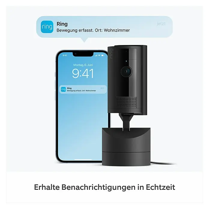 Ring Innenkamera beweglich Pan-Tilt Indoor Camera - 1.080 Pixel (Full HD), Schwarz - Das Bild zeigt eine Ring Sicherheitskamera, die neben einem Smartphone steht, das eine Benachrichtigung anzeigt.