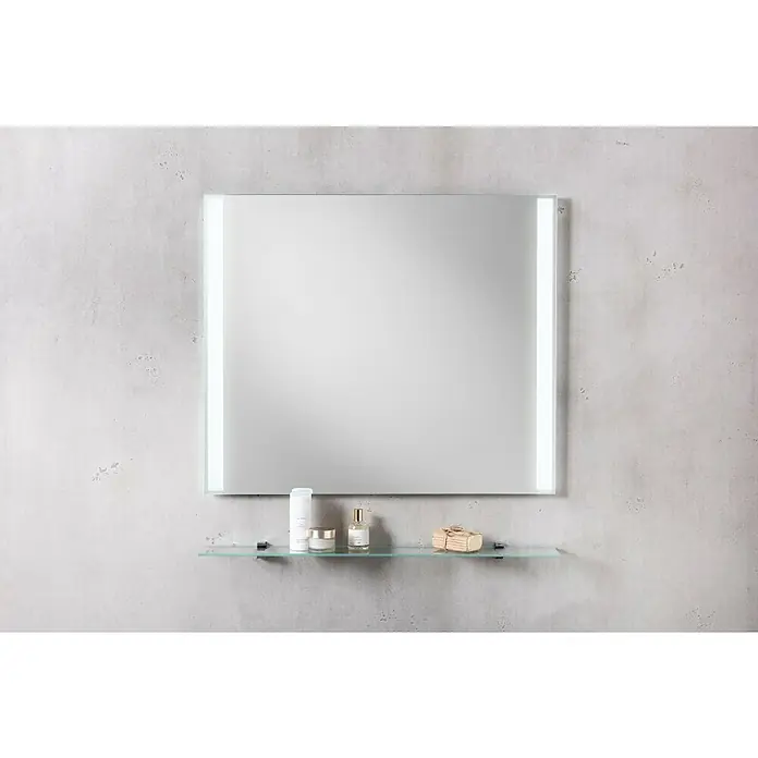 Fackelmann Mirrors LED-Lichtspiegel - B x H: 80 x 68 cm, Einfacher Anschluss über Schraubklemme, Rechteckig - Ein quadratischer Spiegel mit eingebauter Beleuchtung, der über einem Glasregal an einer grauen Wand hängt, bietet eine stilvolle Badezimmerlösung.
