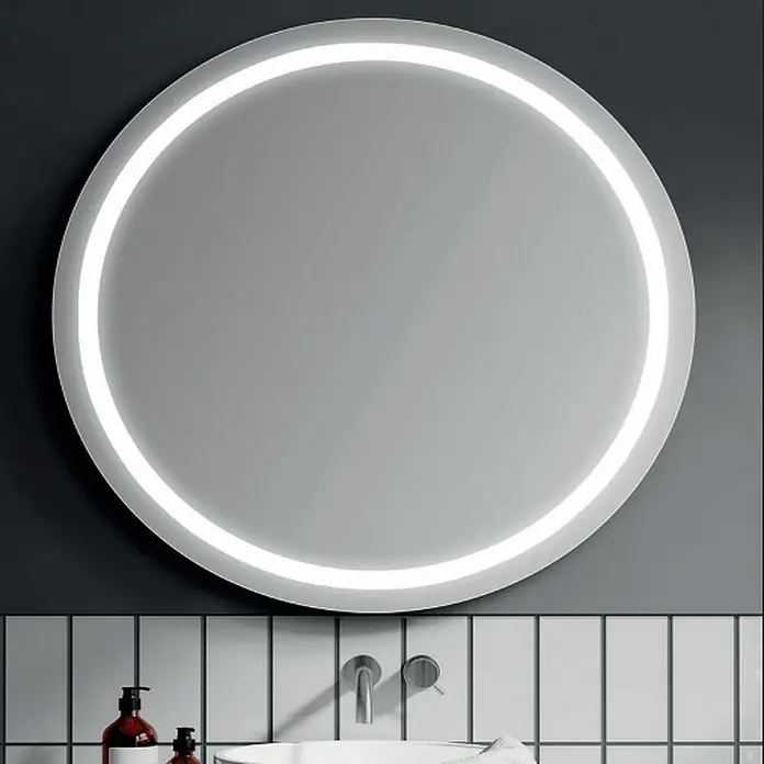 Bath Stage Espejo con luz B-920 - Diámetro: 60 cm, Blanco frío - Un espejo de baño redondo con iluminación integrada cuelga sobre un lavabo.