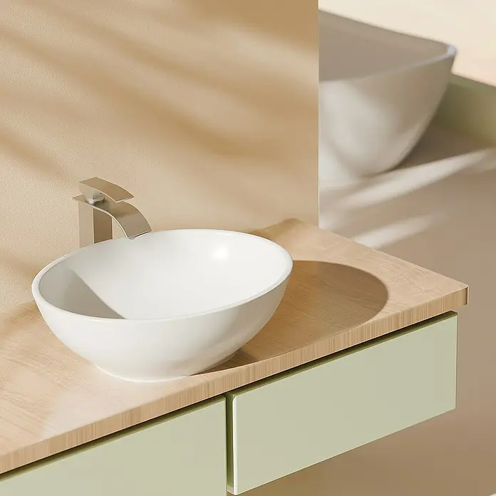 Emke Aufsatzwaschbecken Novix - 33,5 x 41,5 cm, Hahnloch: Ohne, Ohne Überlauf, Weiß - Elegantes Badezimmerwaschbecken-Design mit einer runden, weißen Schale und einer modernen Armatur, die auf einem Holzunterschrank mit grünen Schubladen montiert ist.