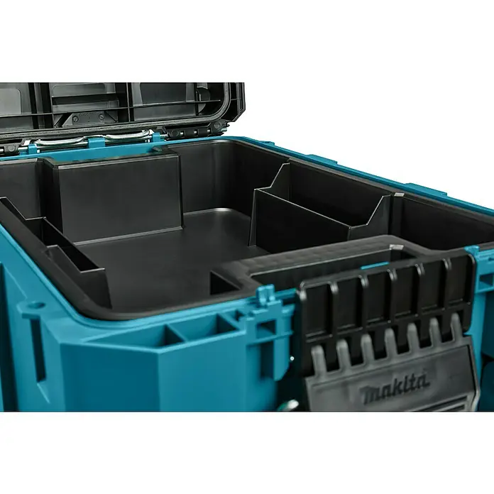 Makita Werkzeugkasten Maktrak XL - Kunststoff, L x B x H: 56,5 x 39,4 x 40,2 cm - Innenansicht eines offenen, türkisfarbenen Makita Werkzeugkoffers mit schwarzen Fächern zur Werkzeugaufbewahrung.