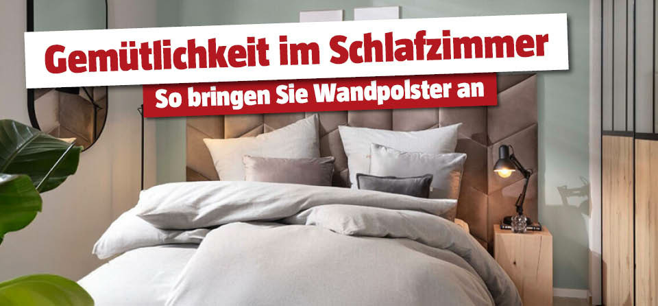 Wandpolster im Schlafzimmer, davor ein Bett 
