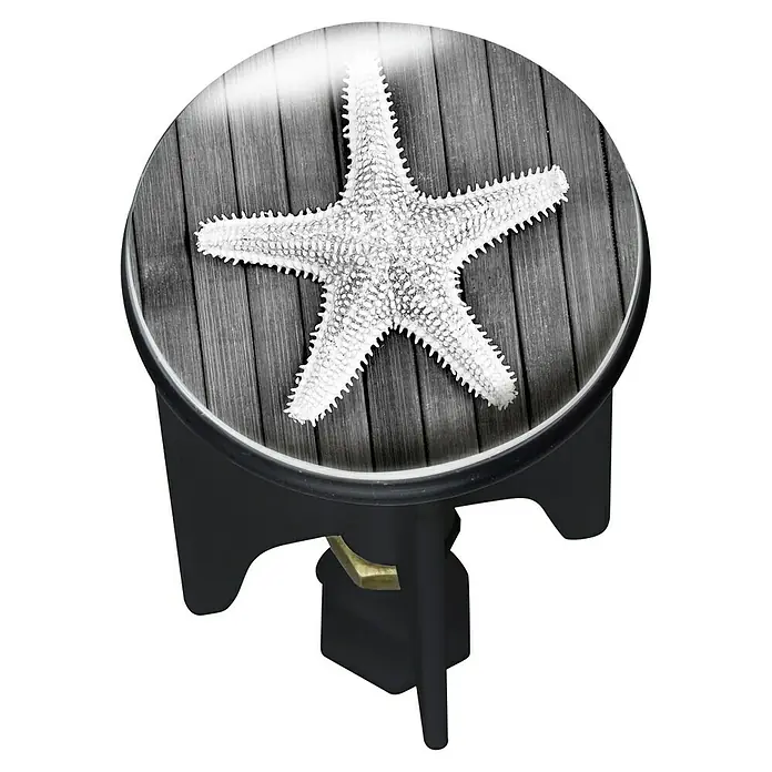 Wenko Design-Excenterstopfen - Siracusa, Durchmesser: 3,9 cm - Ein runder Beistelltisch mit Seestern-Design auf einer grauen Holzoberfläche und dunklen Beinen. Ideal für maritime Akzente.