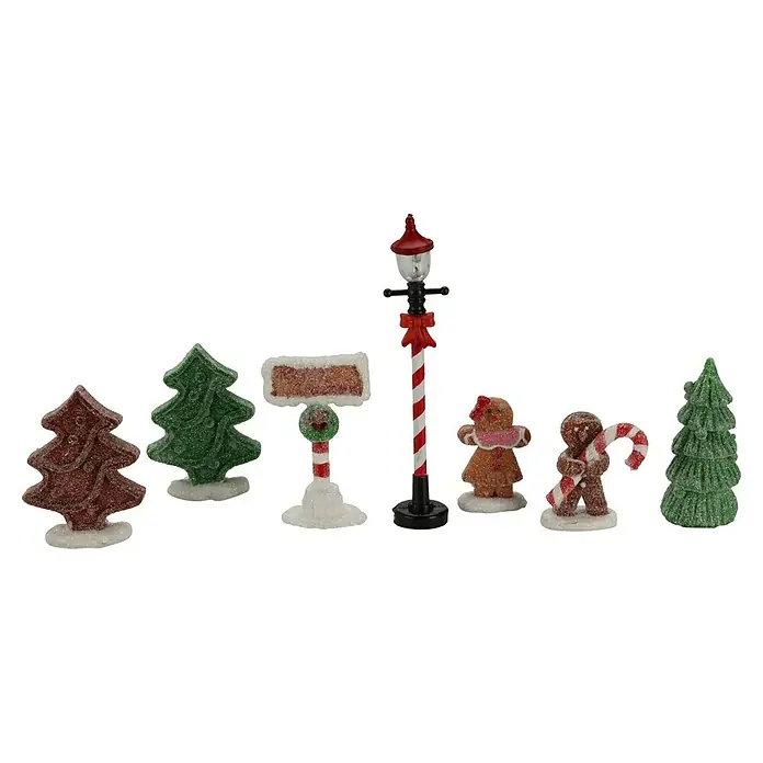 LED-Weihnachtsdorf Lebkuchenhaus - 9,5 x 9,5 x 13 cm, LED, Batteriebetrieben - Süße Weihnachtsdekoration mit Zuckergußdetails, darunter Bäume, Lebkuchenfiguren und eine festliche Straßenlaterne.