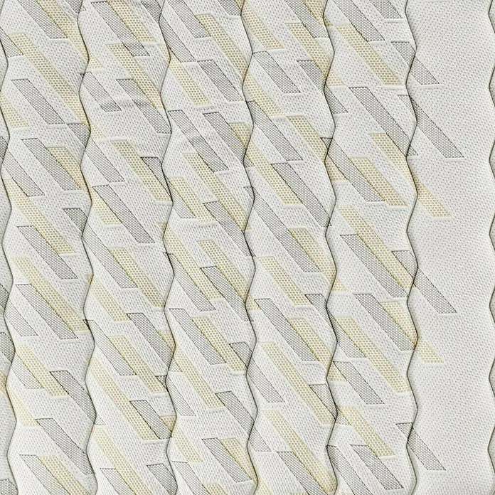 Espacio Descanso Colchón - Largo: 190 cm, Ancho: 90 cm, Altura: 24 cm, Espuma HR y Viscoelástica, Colchón a 2 caras - Primer plano de una funda de colchón con un patrón geométrico de rayas blancas, grises y beige.