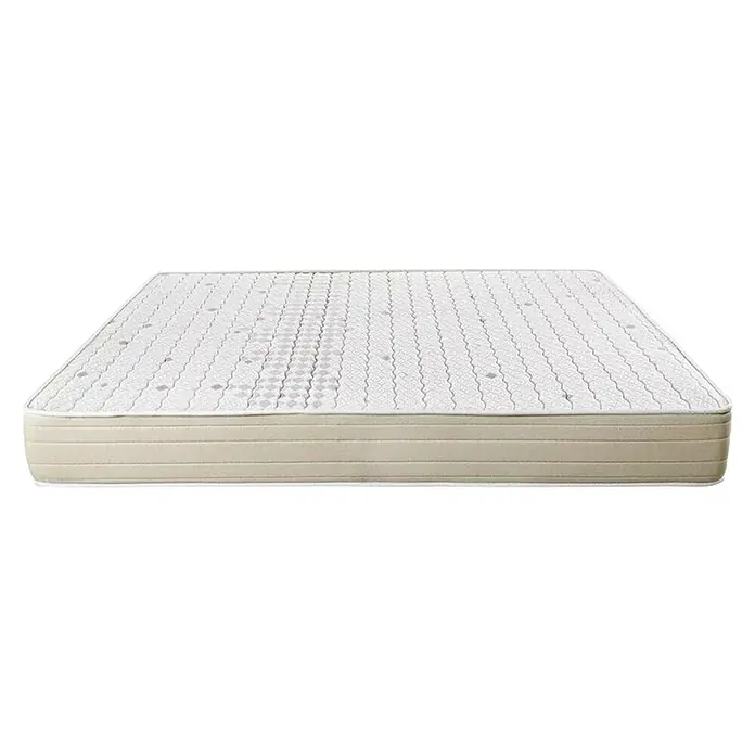 Espacio Descanso Colchón - Largo: 190 cm, Ancho: 135 cm, Altura: 22 cm, Espuma HR y Viscoelástica, Colchón a 2 caras - Primer plano de un colchón con superficie acolchada y laterales beige, que ofrece confort y soporte para un sueño reparador.