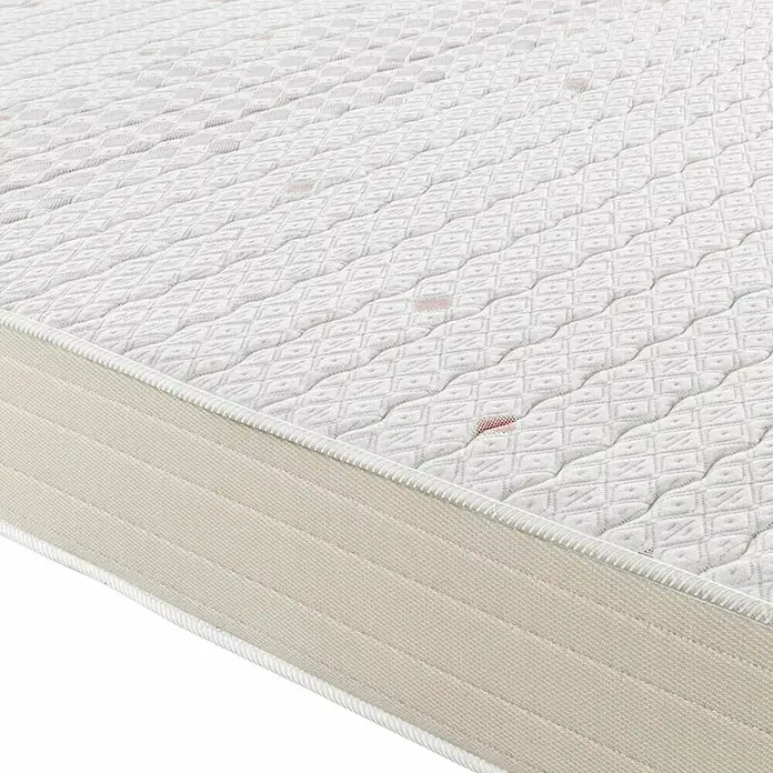 Espacio Descanso Colchón - Largo: 190 cm, Ancho: 135 cm, Altura: 22 cm, Espuma HR y Viscoelástica, Colchón a 2 caras - Primer plano de un colchón con funda blanca y patrón acolchado, prometiendo confort y calidad para un sueño reparador.