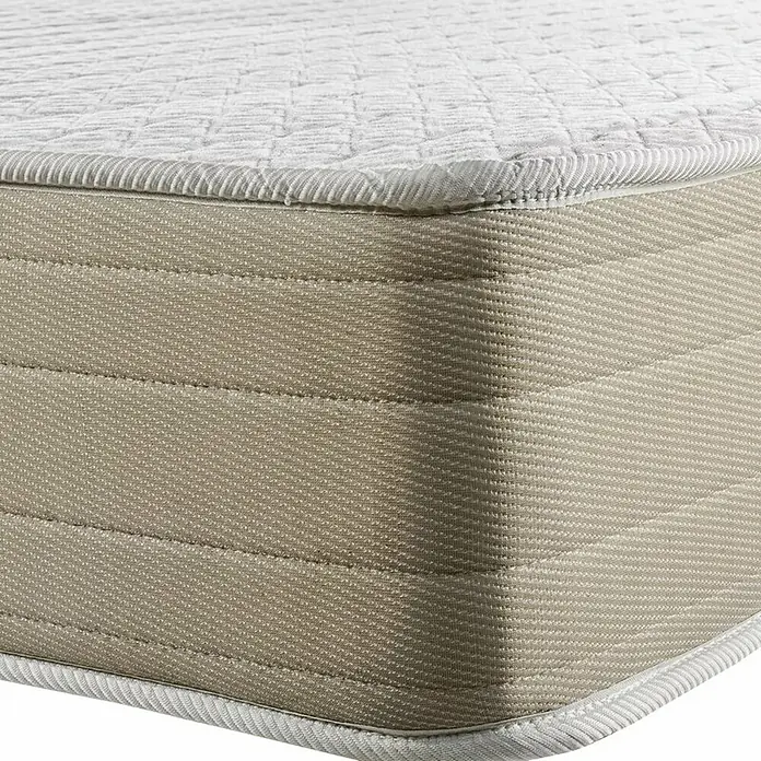 Espacio Descanso Colchón - Largo: 190 cm, Ancho: 135 cm, Altura: 22 cm, Espuma HR y Viscoelástica, Colchón a 2 caras - Primer plano de un colchón con superficie acolchada y laterales beige con costuras decorativas.