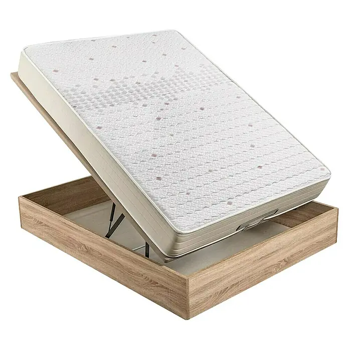 Espacio Descanso Canapé y colchón - L x An x Al: 190 x 135 x 54 cm, Natural, Abatible, Espuma HR y Viscoelástica - La imagen muestra una cama con un somier que está plegado para crear espacio de almacenamiento. El colchón tiene un patrón de pequeños cuadrados.