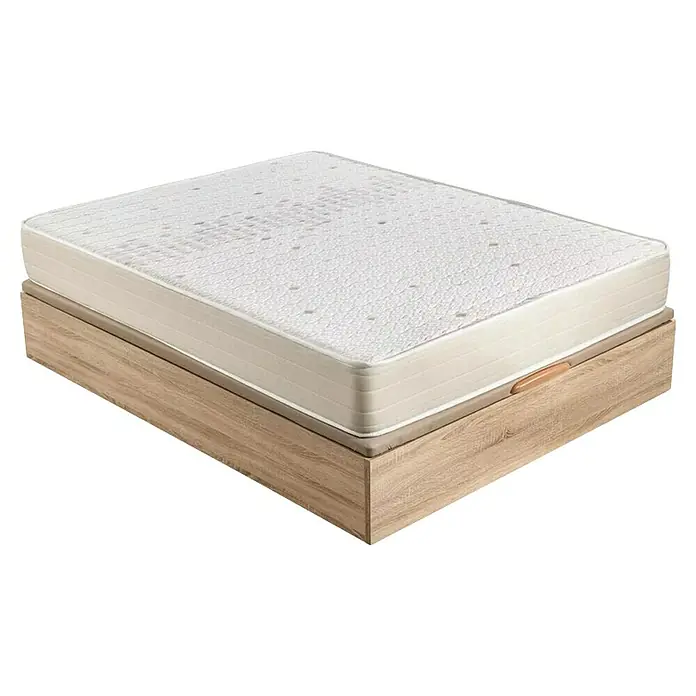 Espacio Descanso Canapé y colchón - L x An x Al: 190 x 135 x 54 cm, Natural, Abatible, Espuma HR y Viscoelástica - Primer plano de un colchón con una funda blanca y un patrón de puntos, apoyado sobre un marco de madera clara.