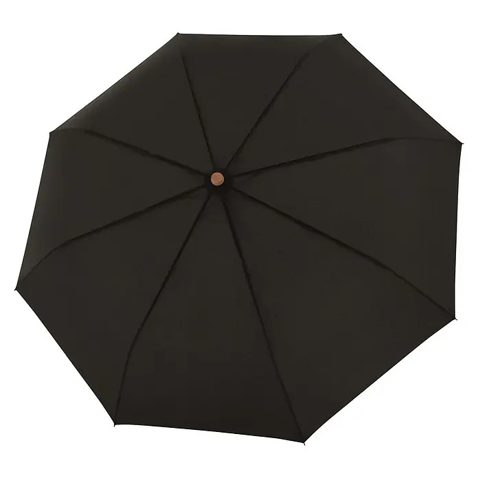 Doppler Taschenschirm Nature - Simply Black, Durchmesser Bespannung: 97 cm, Länge: 29 cm - Nahaufnahme eines schwarzen Regenschirms von oben, der auf einem schwarzen Hintergrund liegt.