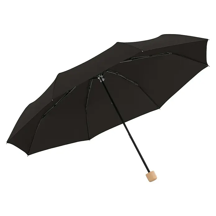 Doppler Taschenschirm Nature - Simple Black, Durchmesser Bespannung: 96 cm, Länge: 25 cm - Eine Nahaufnahme eines schwarzen Regenschirms mit Holzgriff, der auf einer hellen Oberfläche steht. Er spendet Schatten und schützt vor Regen.