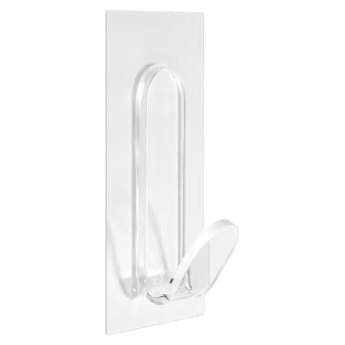Inofix Colgador adhesivo - L x An x Al: 110 x 61 x 30 mm, Plástico, Transparente - Un gancho adhesivo transparente para montaje en pared, ideal para objetos ligeros y fácil instalación sin taladro.