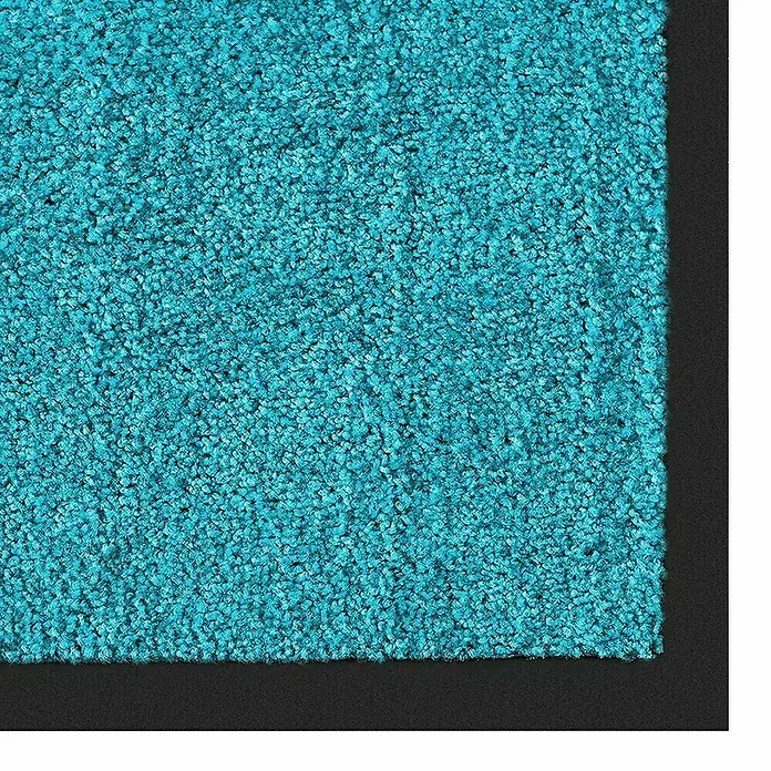 Fußmatte Rhine - Türkis, 180 x 120 cm, 100 % Polyamid - Nahaufnahme eines türkisfarbenen Teppichs mit schwarzem Rand. Die Textur des Teppichs ist flauschig und dicht.
