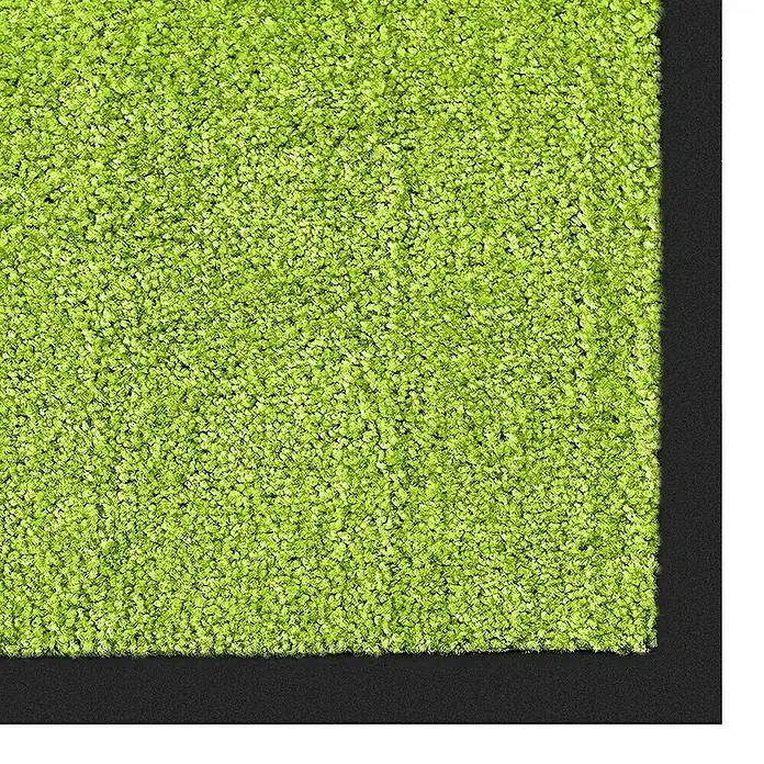 Fußmatte Rhine - Limone, 60 x 40 cm, 100 % Polyamid - Nahaufnahme eines grünen Shaggy-Teppichs mit dunklem Rand. Ideal für Wohnbereiche und Kinderzimmer, bringt Komfort und Farbe ins Zuhause.