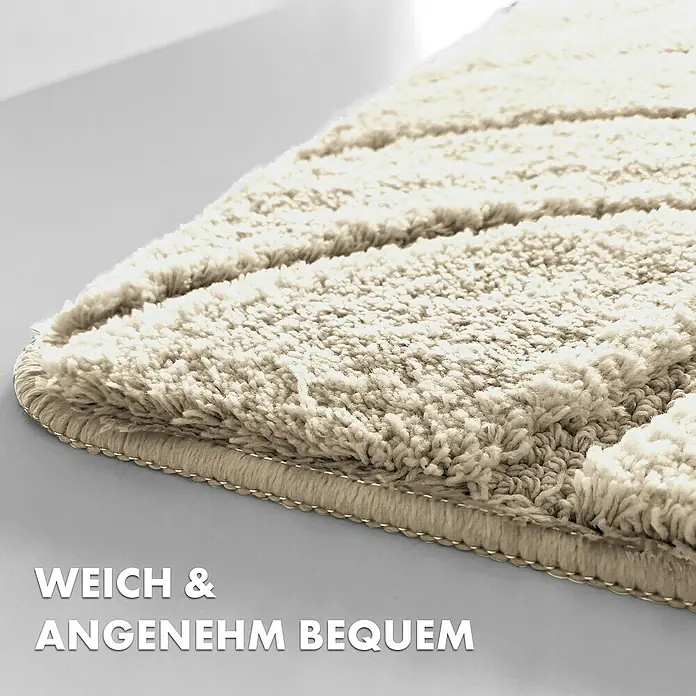 Floordirekt Badteppich Maris - 120 x 60 cm, Ivory, 100% Polyester - Detailaufnahme eines weichen, beigen Badvorlegers mit Streifenmuster. Der Teppich verspricht Komfort und Gemütlichkeit im Badezimmer.