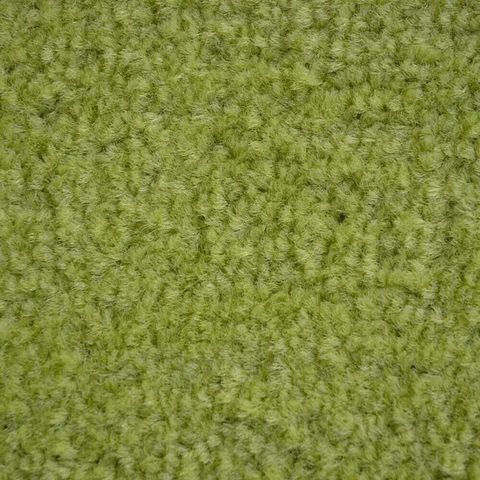 Fußmatte Monochrom - Limone, 180 x 60 cm, 100 % Polyamid - Nahaufnahme von einem grünen Teppich. Die Textur ist weich und flauschig. Perfekt für Wohnzimmer oder Schlafzimmer.