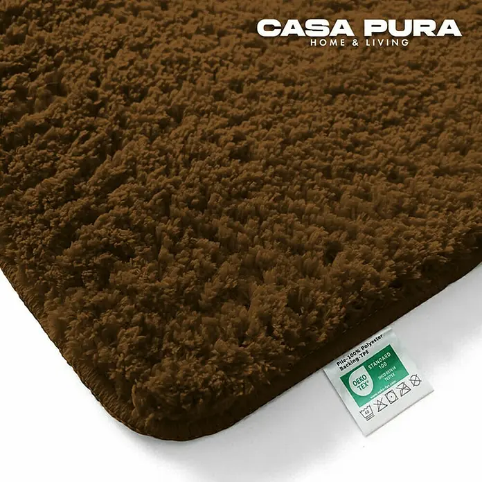 Floordirekt Badteppich Sky - 150 x 80 cm, Braun, 100% Polyester - Nahaufnahme eines braunen Casa Pura Teppichs mit weicher Textur und OEKO-TEX Standard 100 Zertifizierung.