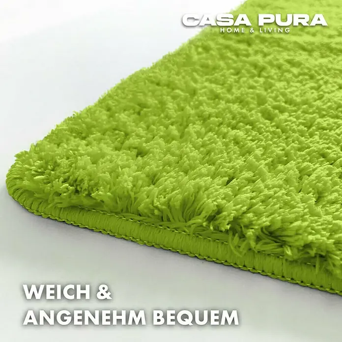 Floordirekt Badteppich Sky - 150 x 80 cm, Apfelgrün, 100% Polyester - Nahaufnahme eines grünen, flauschigen Casa Pura Teppichs, der Weichheit und Komfort verspricht.
