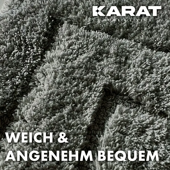 Floordirekt Badteppich Atlantis - 100 x 60 cm, Dunkelgrau, 100% Polyester - Nahaufnahme eines weichen, grauen Teppichs der Marke Karat Home & Living, der Komfort und Gemütlichkeit verspricht.