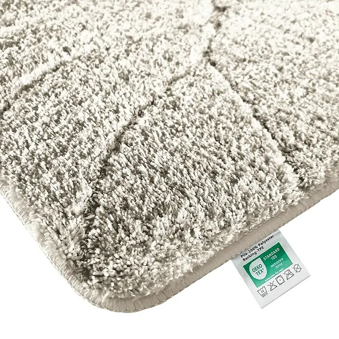 Floordirekt Badteppich Maris - 120 x 60 cm, Ivory, 100% Polyester - Nahaufnahme eines beigen, rechteckigen Teppichs mit einer OEKO-TEX Standard 100 Zertifizierung. Weiche Textur.