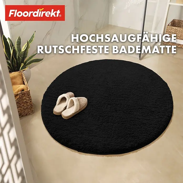 Floordirekt Badteppich Sky - 120 x 120 cm, Schwarz, 100% Polyester - Schwarze, runde Badematte mit dem Aufdruck "HOCHSAUGFÄHIGE RUTSCHFESTE BADEMATTE", zwei Pantoffeln darauf und den Logos "Floordirekt" und "OEKO-TEX".