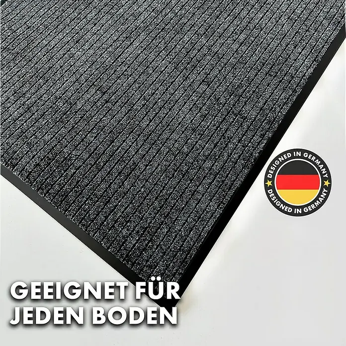 Fußmatte Dura - Anthrazit, 150 x 90 cm, 100 % Polypropylen - Bild einer Fußmatte mit dunklem Rand und der Aufschrift "Geeignet für jeden Boden".