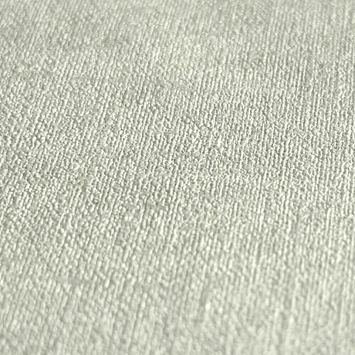 A.S. Création Metropolitan Stories Hot Spots Vliestapete - Grau-Grün, Uni, 10,05 x 0,53 m - Nahaufnahme eines hellen, fein gewebten Stoffes, der eine dezente Textur und ein gleichmäßiges Muster aufweist.