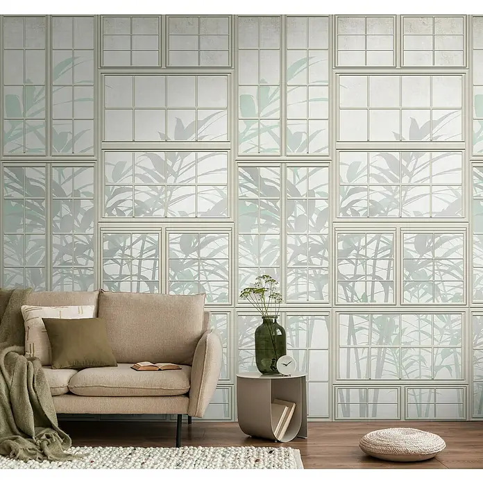 A.S. Création The Wall 3 Fototapete Fenster - B x H: 159 x 280 cm, Vlies - Ein gemütliches Wohnzimmer mit einem beigefarbenen Sofa vor einer Fenster-Tapete mit Pflanzenmotiven.