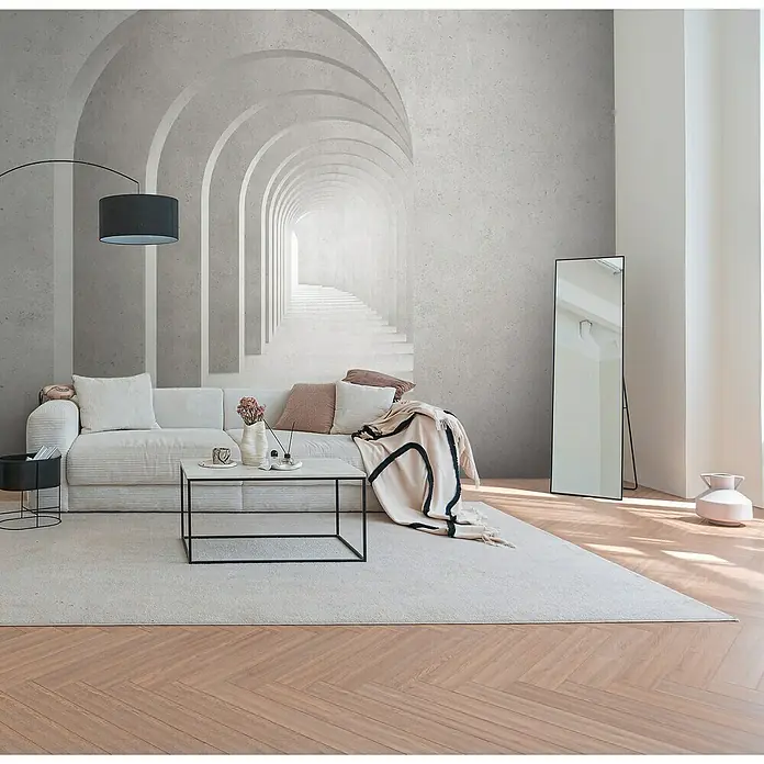 A.S. Création The Wall 3 Fototapete Regenbogen - B x H: 371 x 280 cm, Vlies - Einrichtung mit Sofa, Tisch und Spiegel vor einer Wandtapete mit Torbogenmotiv, die eine moderne und stilvolle Raumatmosphäre schafft.