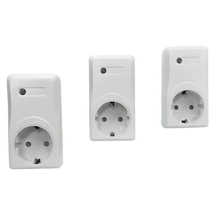 Voltomat Set de enchufes inalámbricos 3+1 - Blanco, 1.000 W - Tres enchufes de pared blancos con protección de contacto sobre fondo negro. Fuente de alimentación práctica para interiores.