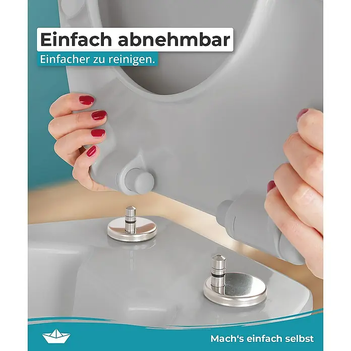 Calmwaters WC-Sitz Original - Duroplast, Grau, Mit Absenkautomatik - Detailaufnahme eines abnehmbaren Toilettensitzes mit Fokus auf die einfache Reinigung und Handhabung.
