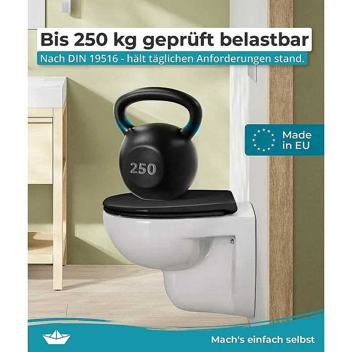Calmwaters WC-Sitz Original - Duroplast, Schwarz, Mit Absenkautomatik - Das Bild zeigt eine Toilette, die mit einem 250 kg schweren Gewicht belastet ist, um ihre Stabilität und Belastbarkeit zu demonstrieren.