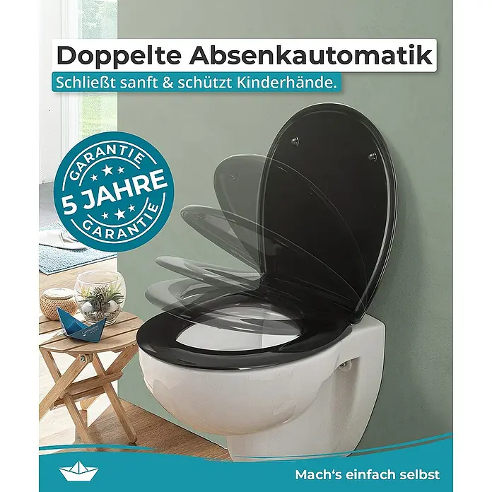 Calmwaters WC-Sitz Original - Duroplast, Schwarz, Mit Absenkautomatik - Das Bild zeigt einen schwarzen Toilettensitz mit Absenkautomatik. Der Toilettendeckel schließt sanft und schützt Kinderhände. 5 Jahre Garantie.