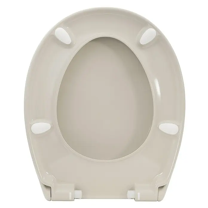 Calmwaters WC-Sitz Original - Duroplast, Beige, Mit Absenkautomatik - Nahaufnahme eines beigen Toilettensitzes mit abgerundeter Form und weißen Stoßdämpfern, der eine saubere Ästhetik und Funktionalität zeigt.