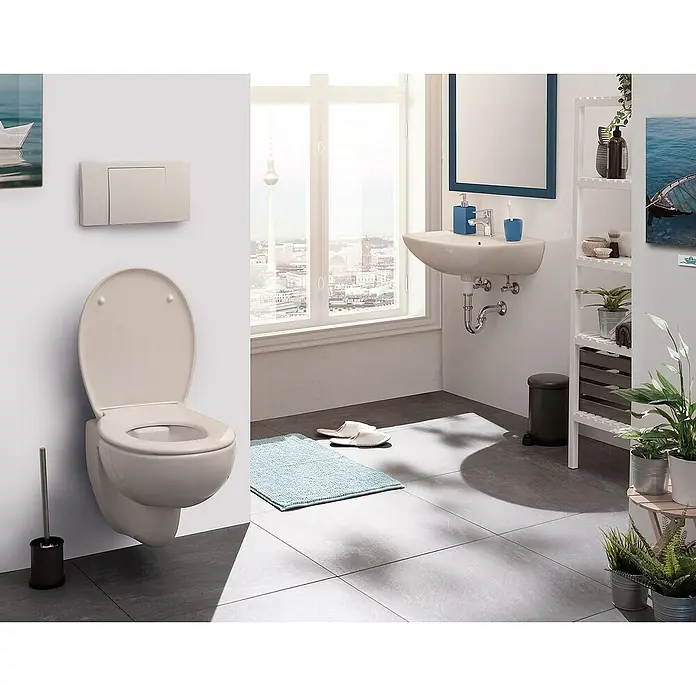 Calmwaters WC-Sitz Original - Duroplast, Beige, Mit Absenkautomatik - Dieses Bild zeigt eine moderne Toilette in einem stilvollen Badezimmer mit hellen Farben und klaren Linien. Die Toilette ist ein elegantes Designelement.