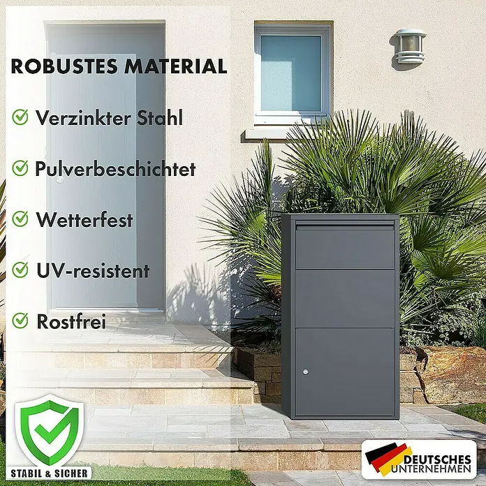 Floordirekt Paketbox Clement mit Klappsystem und Schloss - L x B x H: 22 x 44 x 82 cm, Anthrazit, Stahl, Paketfach - Ein grauer Briefkasten steht vor einer Hauswand. Der Briefkasten ist aus robustem Material gefertigt und bietet viel Platz für Post.
