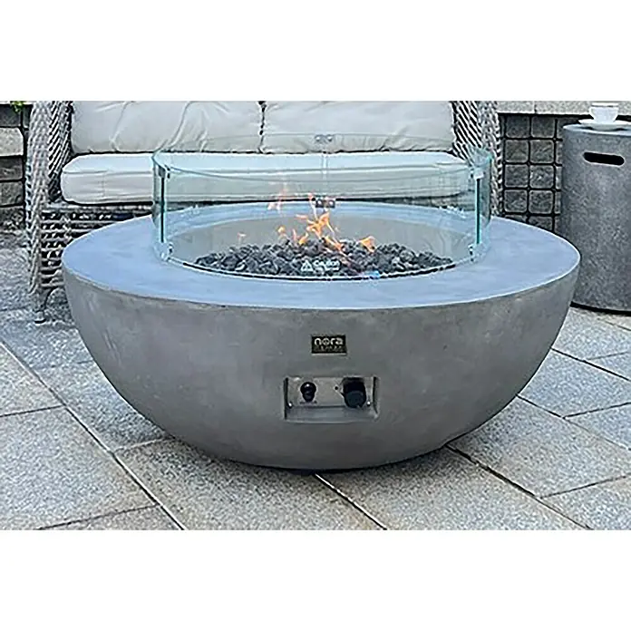 Nora Flames Estufa de exterior Colima - 16 kW, Altura: 40 cm, Gris - Mesa de fuego de gas redonda moderna con vidrio protector y piedras. Perfecta para las tardes acogedoras al aire libre. El diseño elegante se funde en cualquier entorno.
