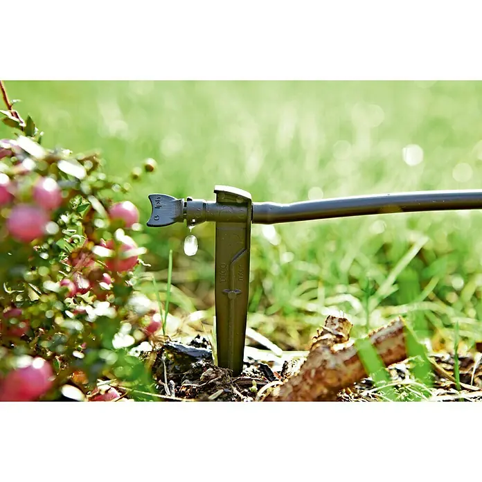 Set de iniciación Multigoteo - Apto para: Riego en línea - Primer plano de un sistema de riego por goteo con emisor para un riego específico y eficiente en el jardín.