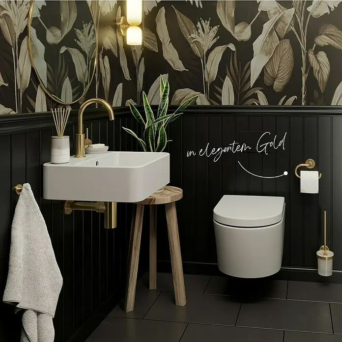 Lenz WC-Kombi-Bürstengarnitur Juna - 4 -tlg., Gold - Elegantes Badezimmerdesign mit goldfarbenen Akzenten. Der Fokus liegt auf dem stilvollen Waschbecken und der schicken Toilette mit Zubehör.