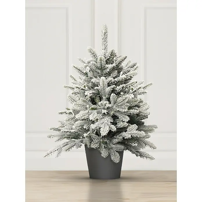 ArtiTree Künstlicher Weihnachtsbaum im Topf LED und Schnee - Höhe: 80 cm, Grün, LED-Beleuchtung - Nahaufnahme eines kleinen, schneebedeckten künstlichen Weihnachtsbaums in einem grauen Topf, der auf einem Holztisch vor einer weißen Wand steht.