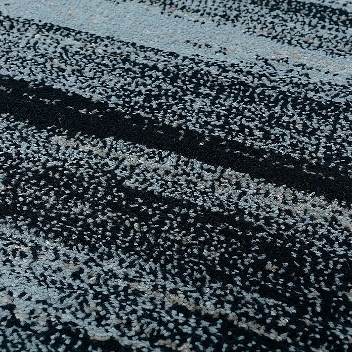 Dekoria Flachgewebeteppich - schwarz, blau, 170 x 120 cm - Nahaufnahme eines gemusterten Teppichs in Schwarz- und Blautönen, der eine moderne Textur zeigt.