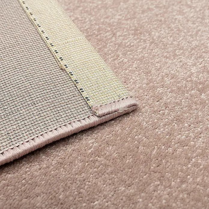 Dekoria Flachgewebeteppich - pink, 170 x 120 cm - Nahaufnahme eines rosafarbenen Teppichs, der die Textur und die Details der Kante zeigt.
