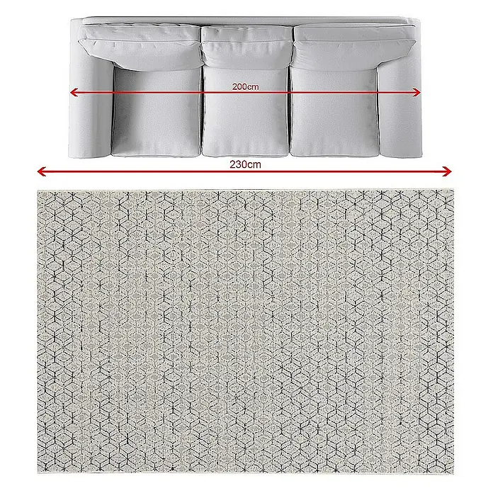 Dekoria Flachgewebeteppich - dunkelblau, creme, 230 x 160 cm - Nahaufnahme des dreisitzigen Sofas und eines gemusterten Teppichs in neutralen Farben, ideal für Wohnräume.
